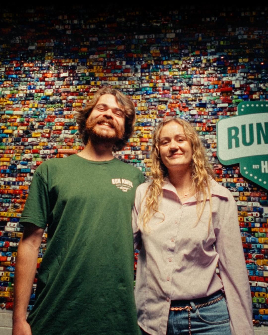 Run Amuk Hotdogs staff in front of the shop’s toy-car wall