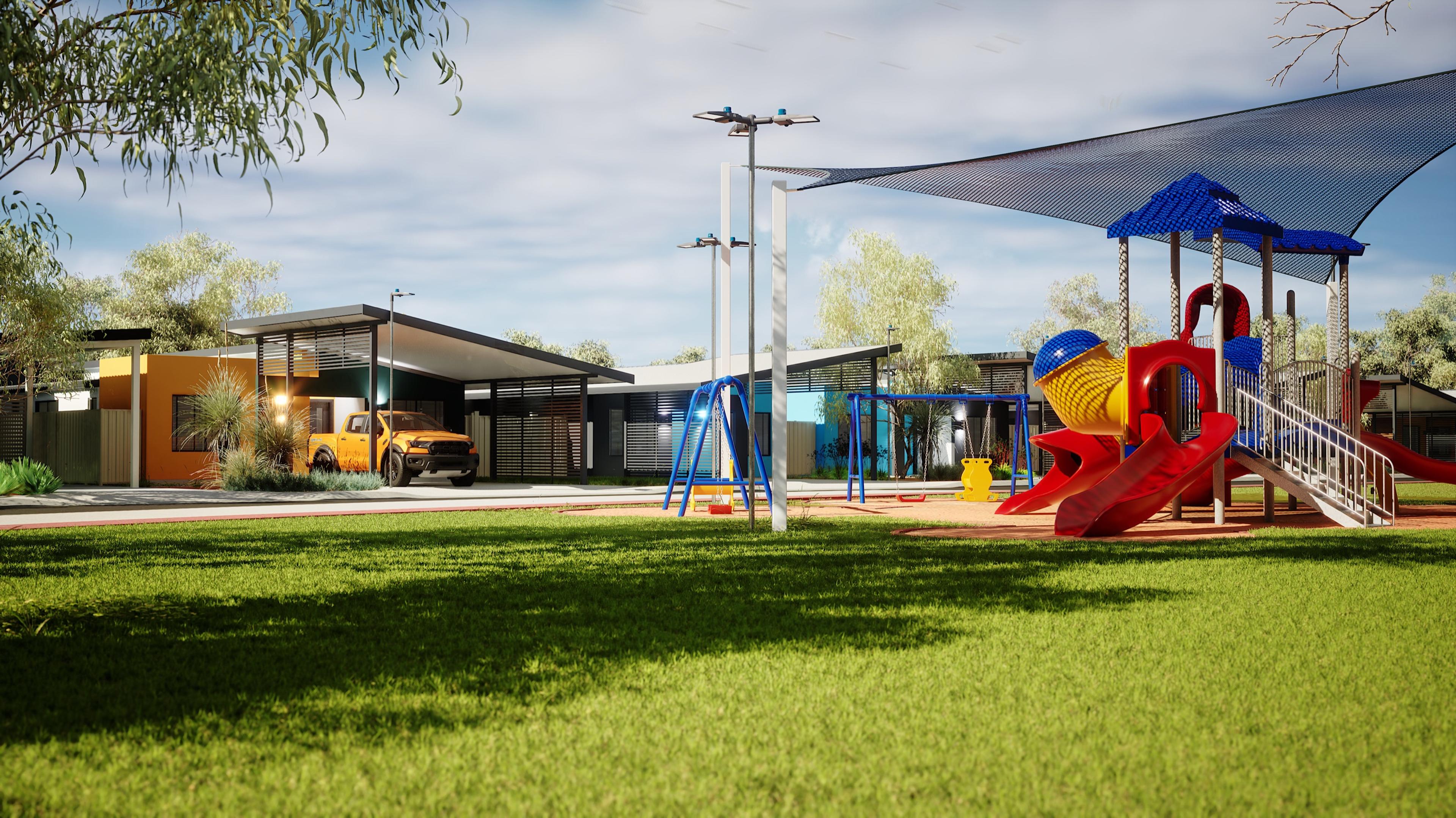 Playground with shade sails in front of new homes