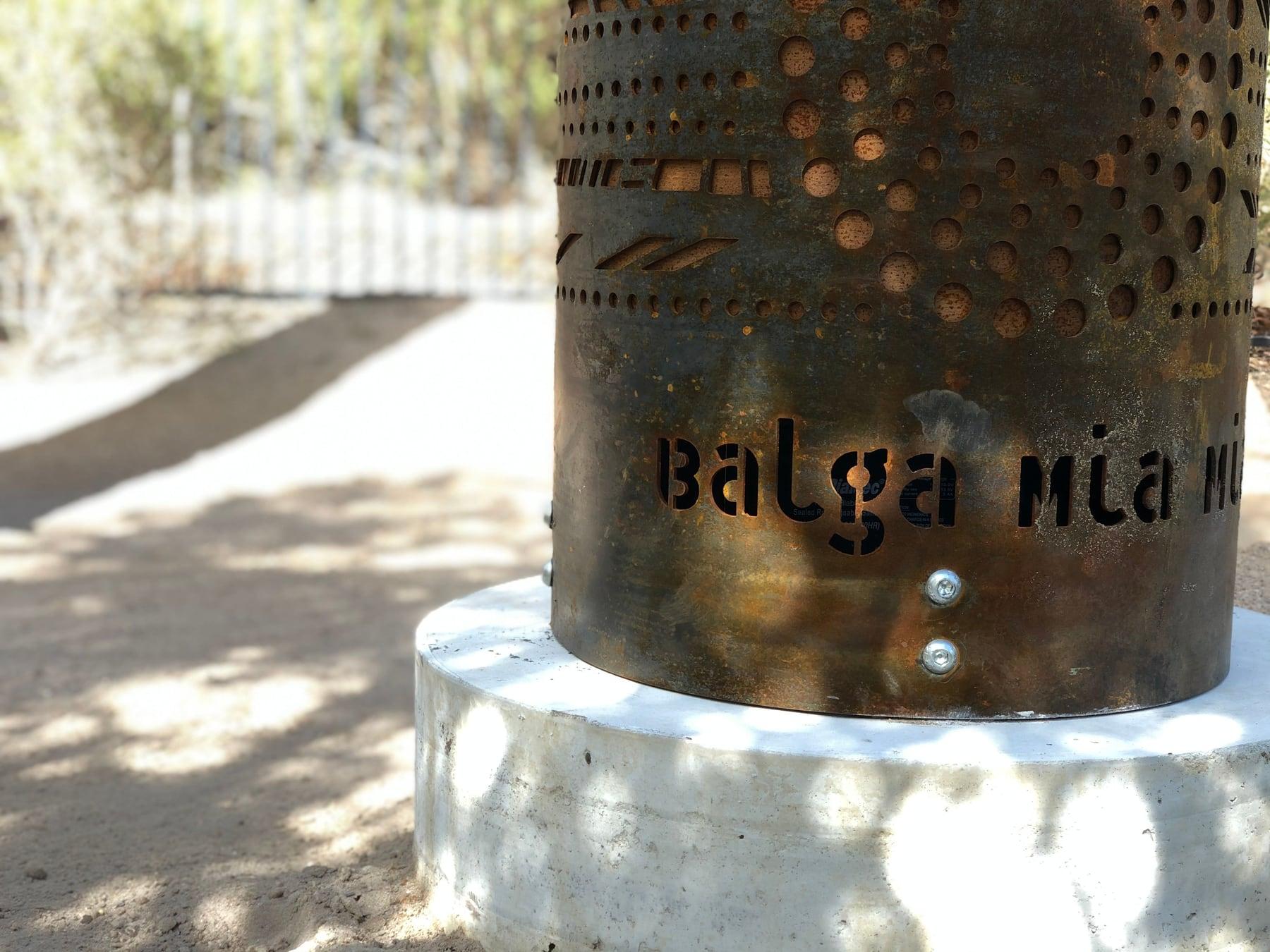 The words Balga Mia Mia cut into the base of a totem