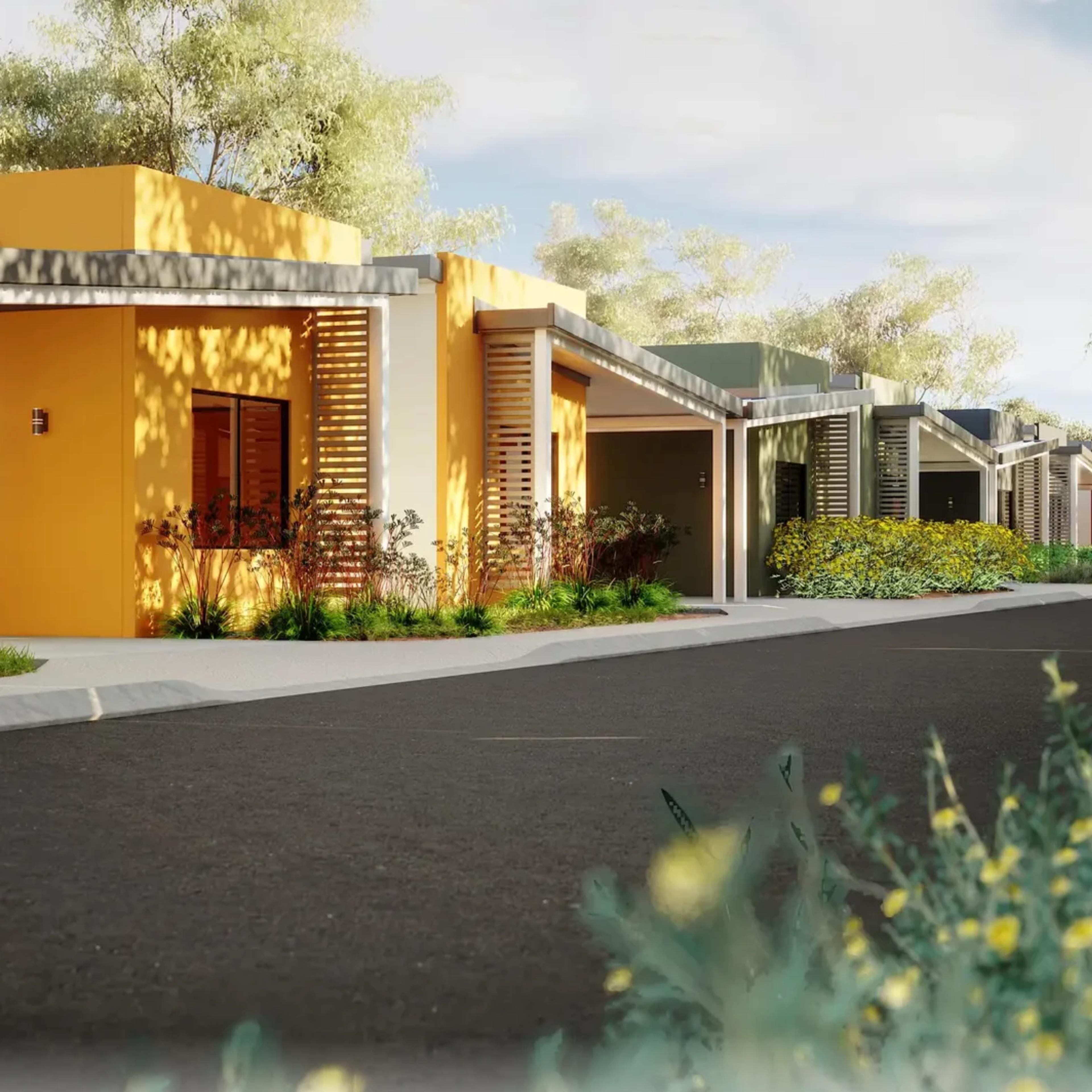 Ochre and sage homes along a tree-lined street, Port Hedland