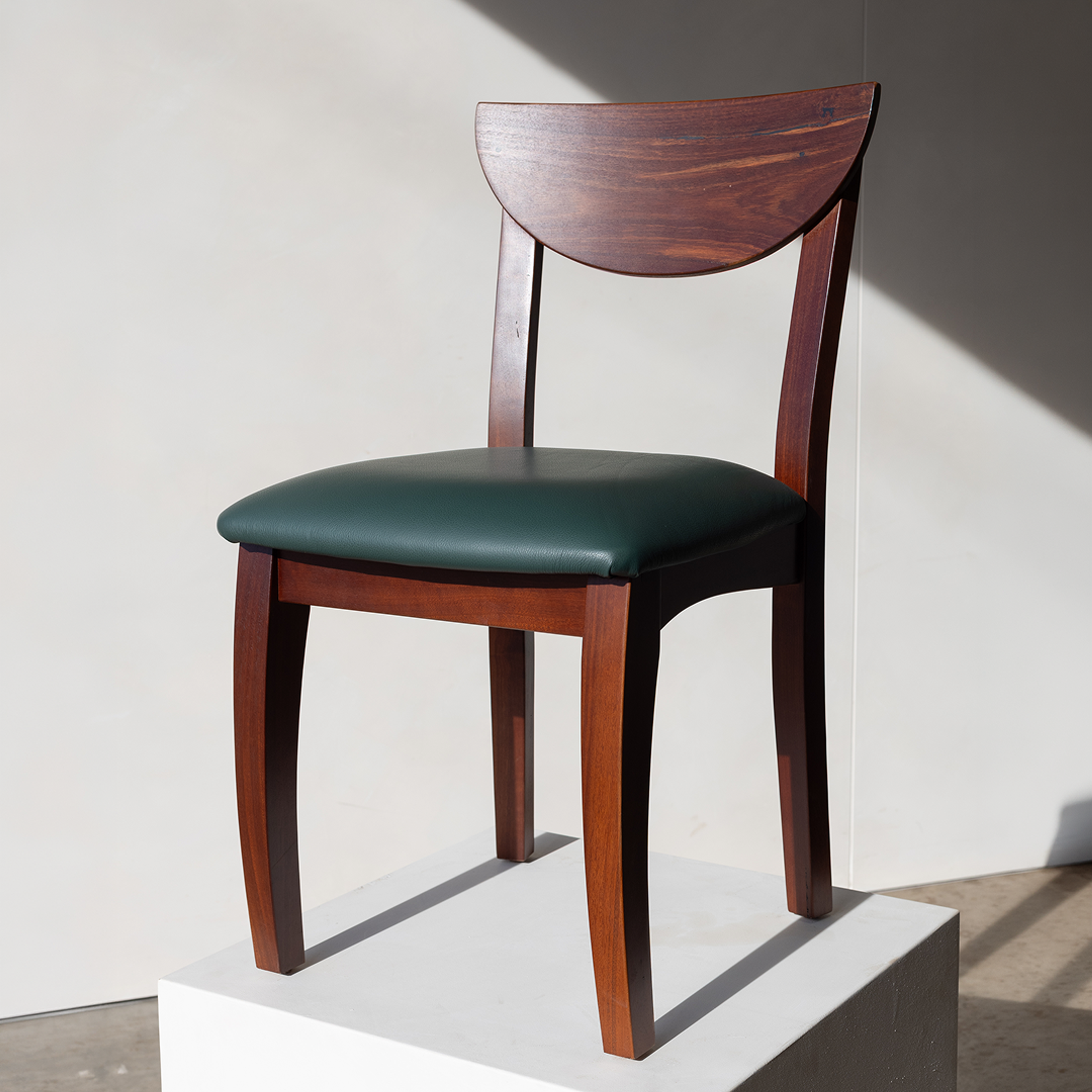 Carousel ad card: the Margaret River dining chair in hard afternoon light