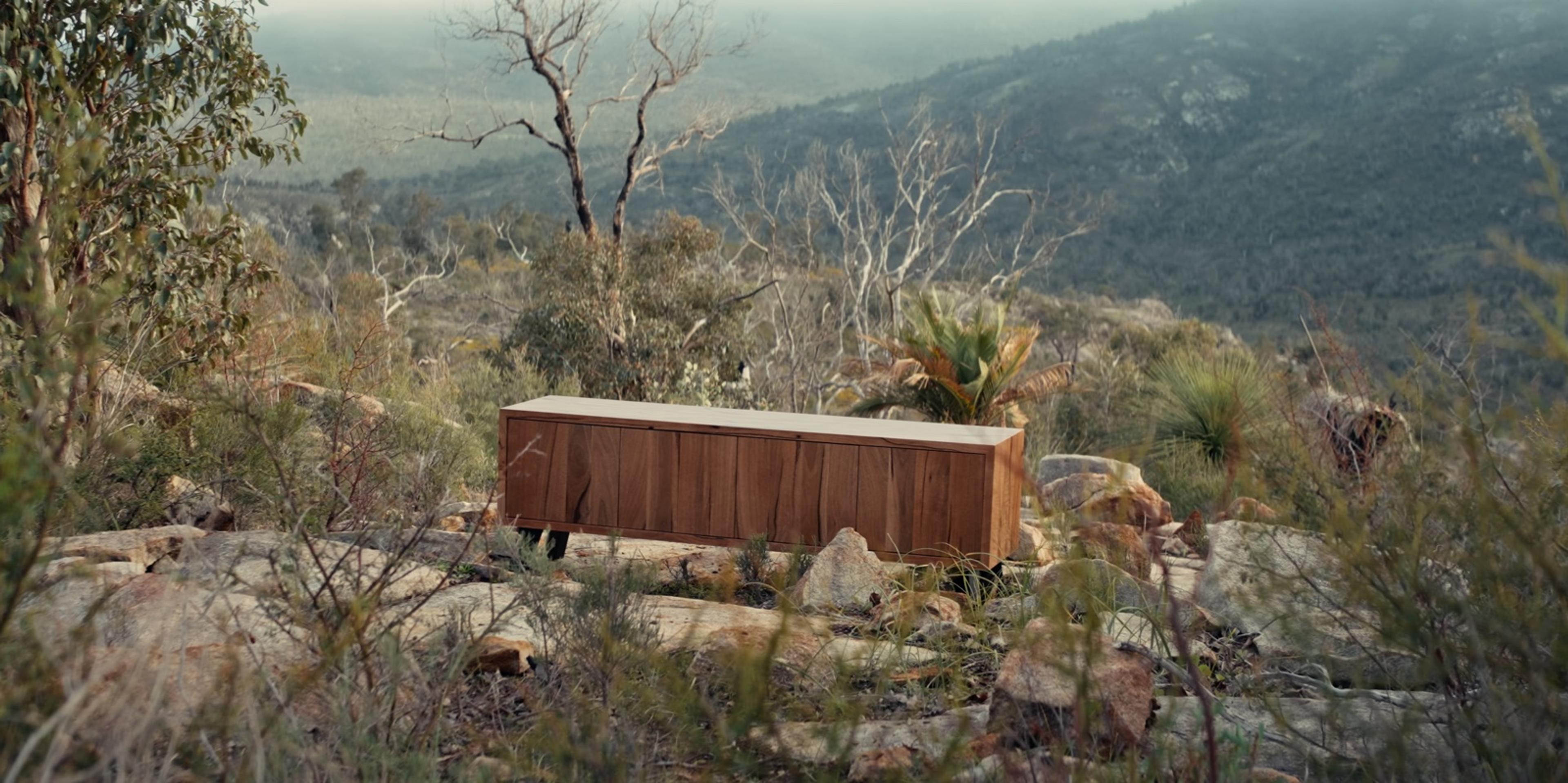 Retro TV unit on a granite outcrop above the hills