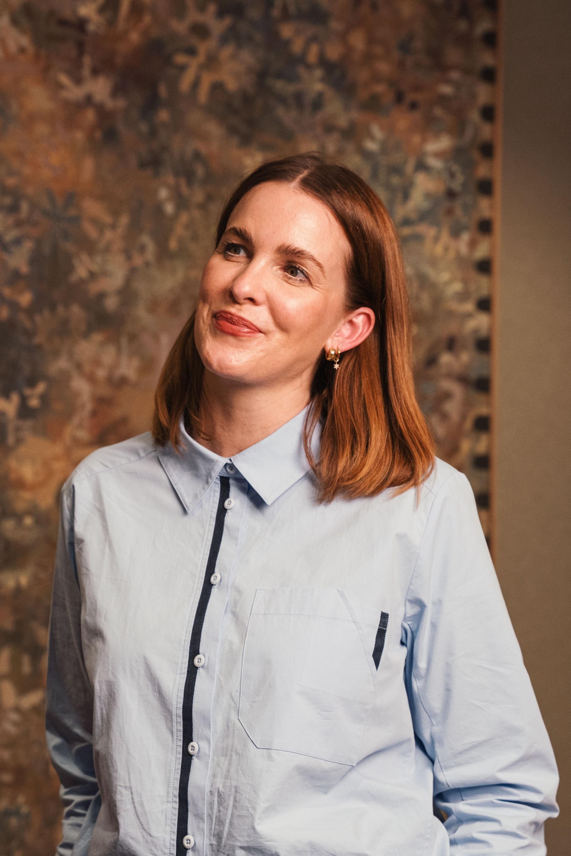 Portrait of an AKT Advisory founding partner in a pale blue shirt