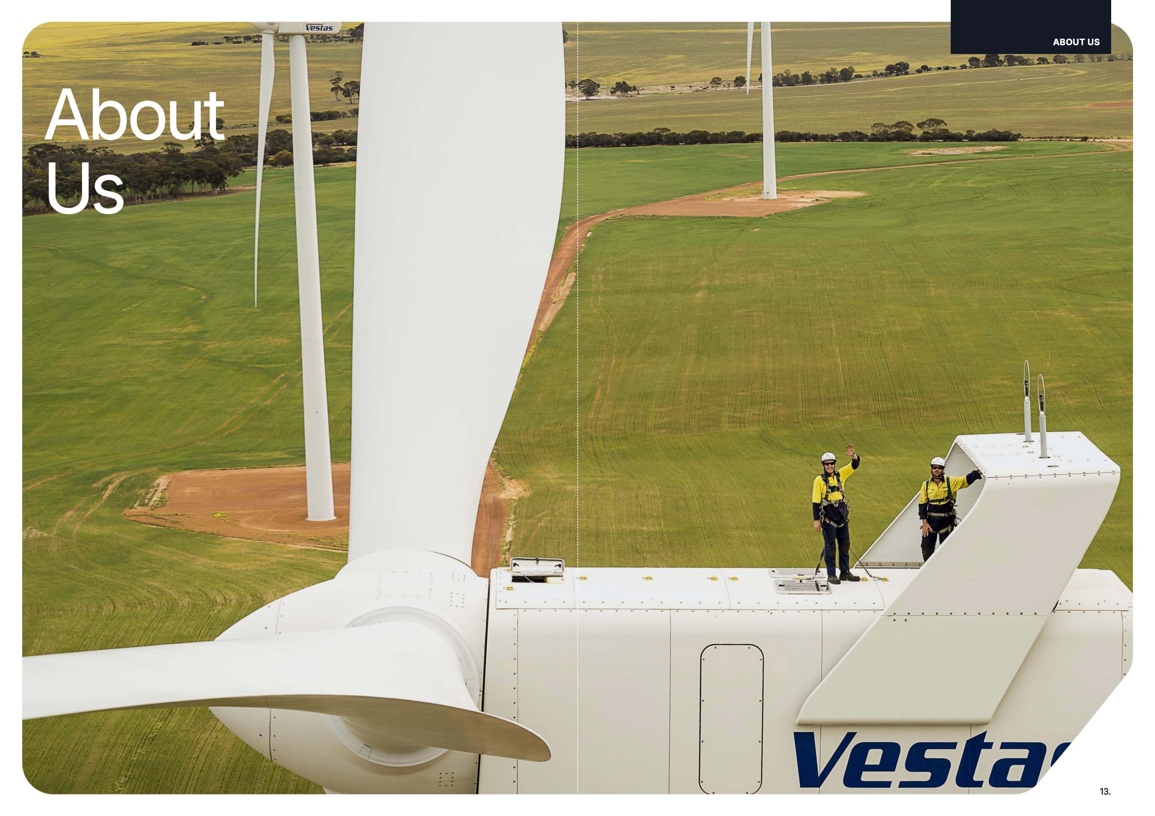 About Us spread: two technicians waving from a turbine nacelle above the paddocks