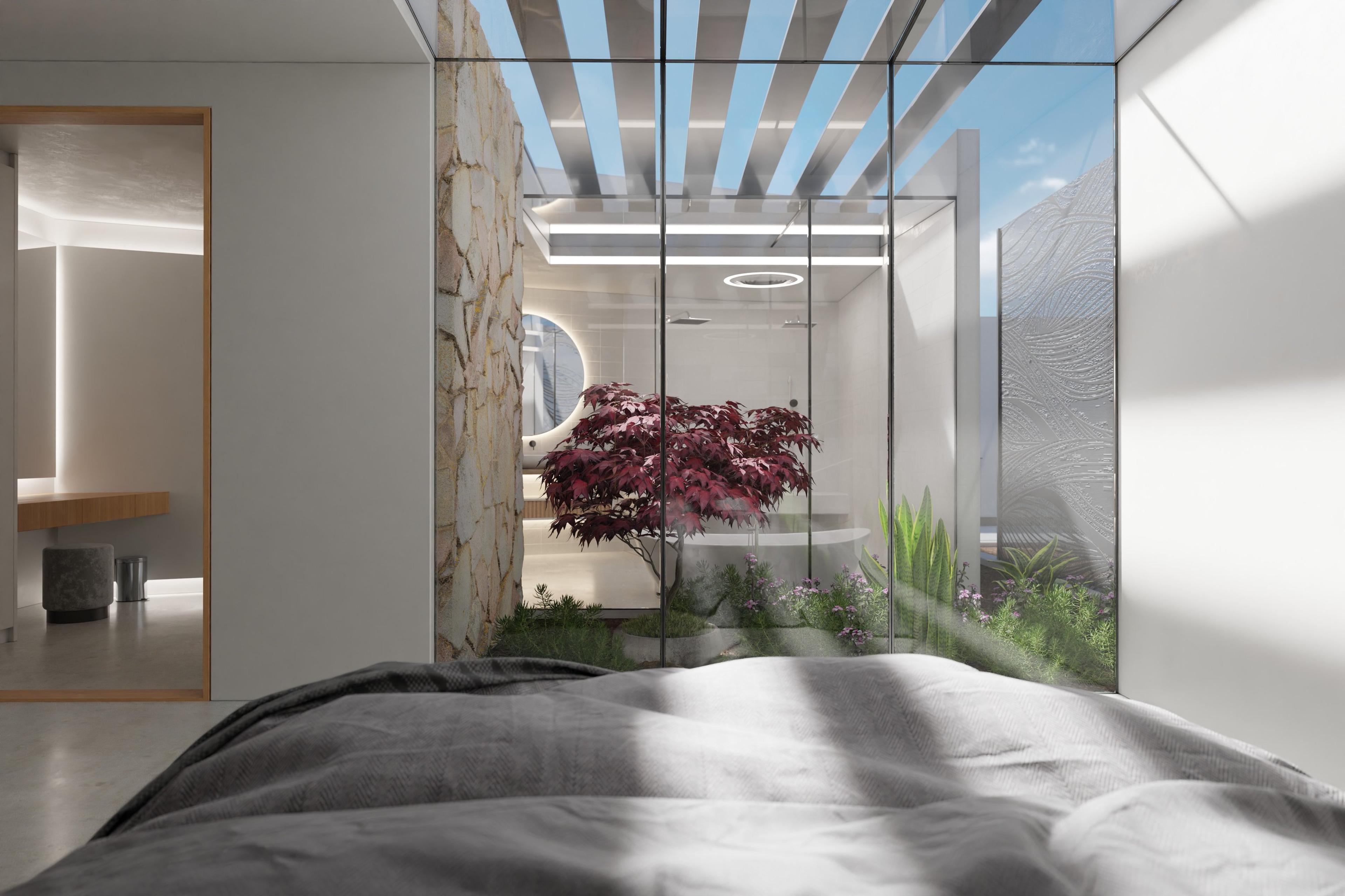 Bedroom opening onto a courtyard garden