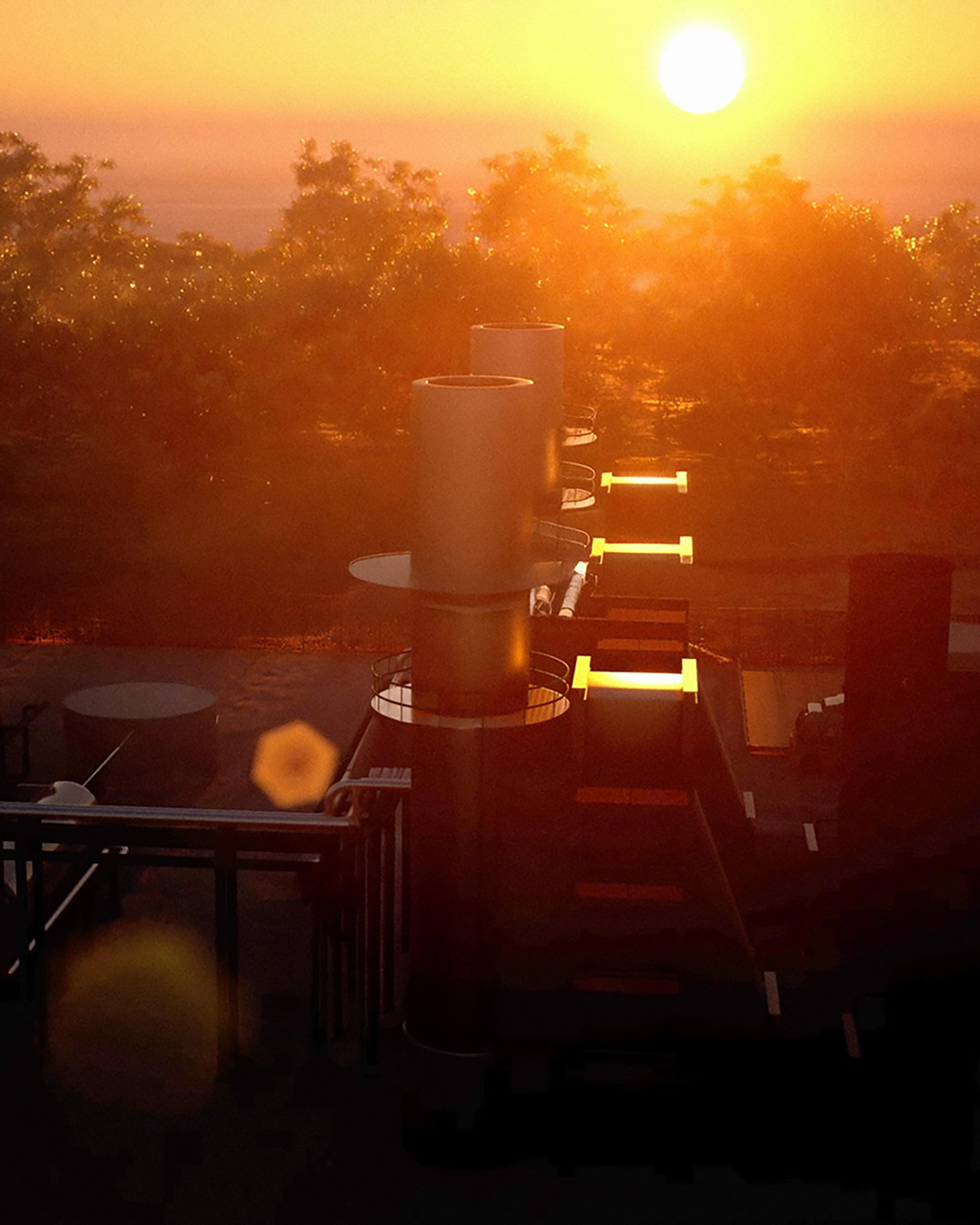 The ATEN power station stacks at sunset