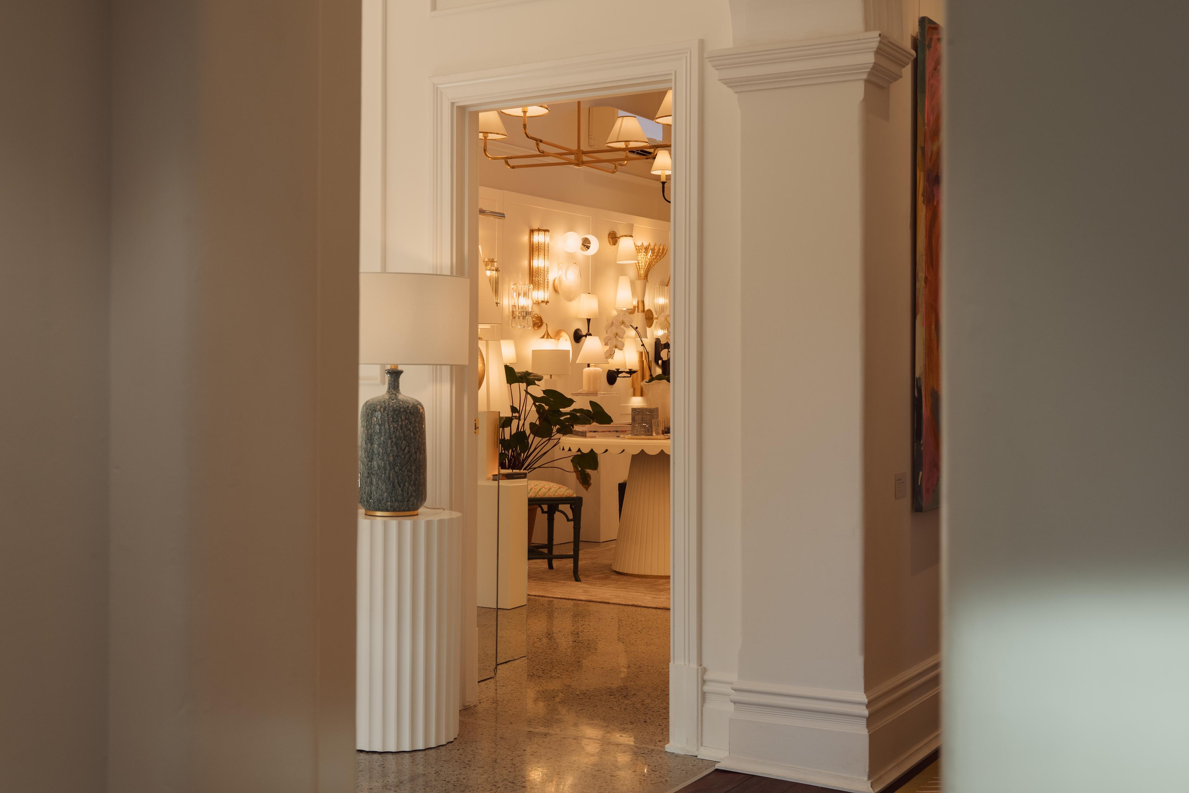 A doorway opening onto a room of glowing wall lights