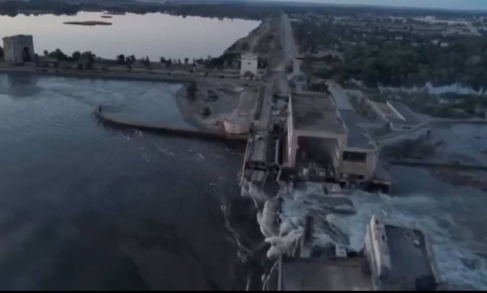 A screen grab captured from a video shows the Kakhovka Hydroelectric Power Plant after a blast occurred in plant which is in the Russian-controlled part of Ukraine's Kherson on June 6, 2023.