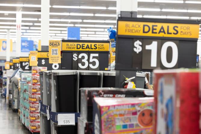 Black Friday deals signs inside a Walmart store.