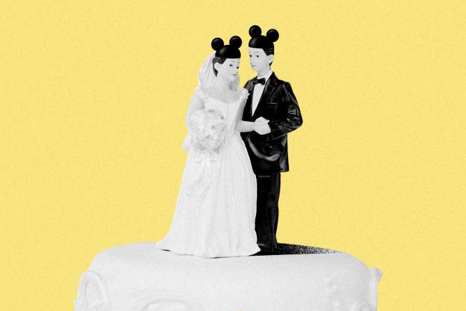 Bride and groom wedding cake topper with mouse ears.
