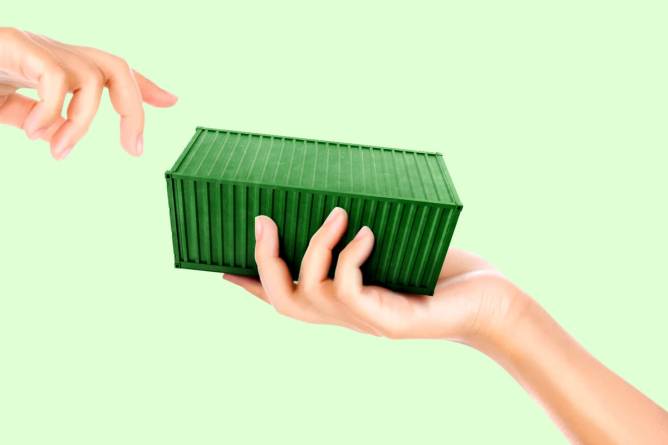 Small green container exchanging hands