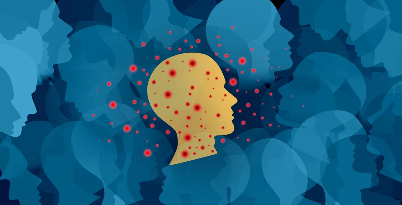 Illustration of faces with one yellow one in the middle that has red spots around it