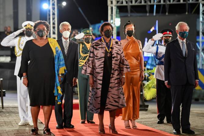 Prime Minister of Barbados Mia Mottley, former cricketer Garfield Sobers, President of Barbados, Dame Sandra Mason, Rihanna, and Prince Charles, Prince of Wales stand during the Presidential Inauguration Ceremony at Heroes Square on November 30, 2021 in Bridgetown, Barbados. 