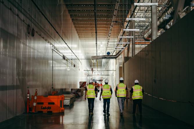 Workers inside Ford's BlueOval Battery Park in Marshall, Michigan.