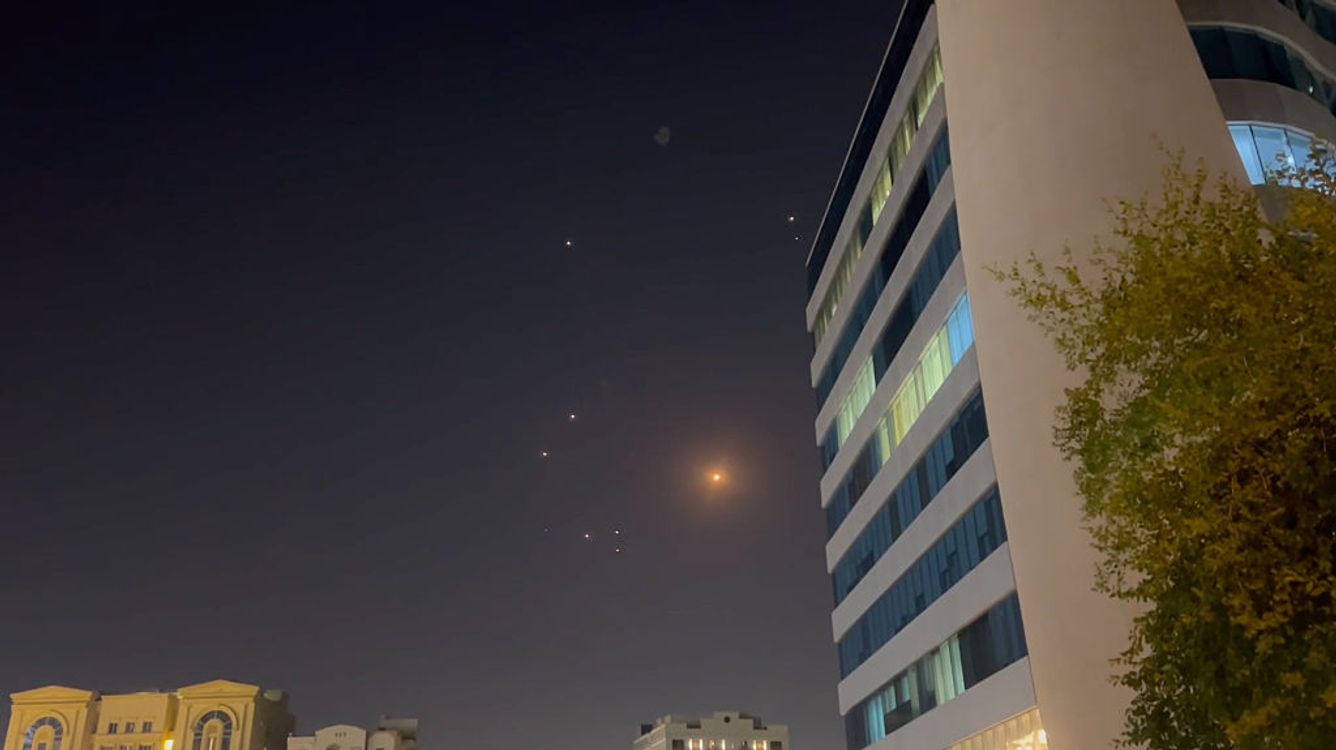  In this frame-grab made from video, missiles and air-defense interceptors illuminate the night sky over Doha after Iran launched an attack on US forces at Al Udeid Air Base on June 23, 2025 in Doha, Qatar. 
