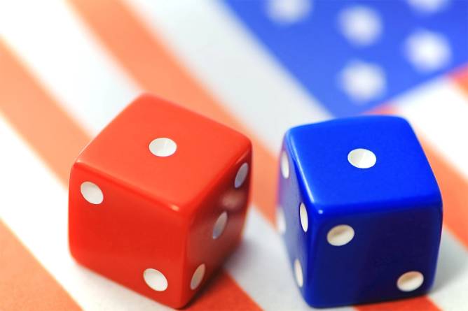 Red and blue dice on an american flag