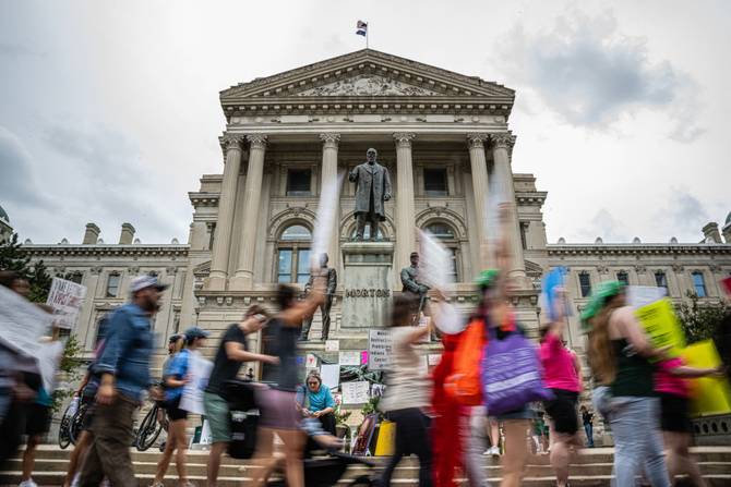 Abortion rights protesters march outside the Indiana State Capitol building on July 25, 2022 in Indianapolis