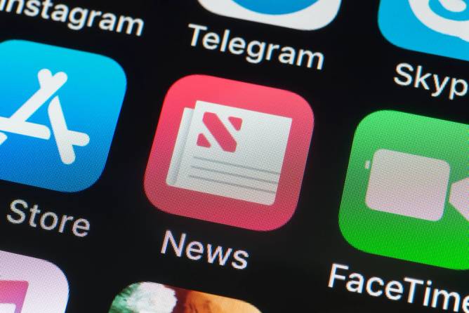 the Apple News app icon on a mobile phone screen