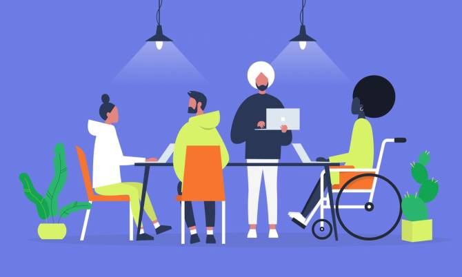 A diverse group of employees gather around a table.