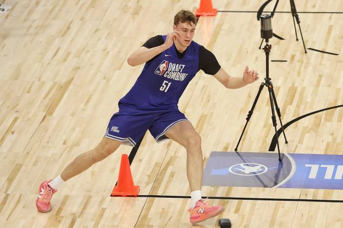 Cooper Flagg on basketball court in New Balances.