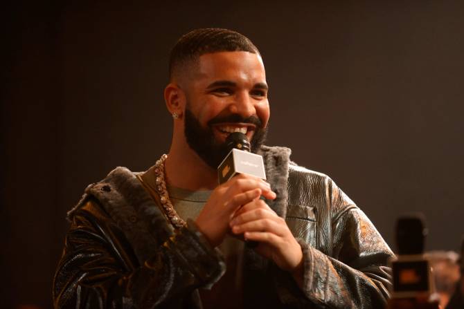 Rapper Drake holding a microphone, Limited Use
