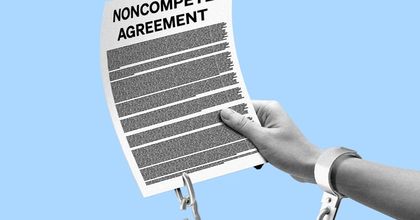 A person’s arm and hand holding up a document labeled “Noncompete Agreement” with handcuffs connecting the arm to the document
