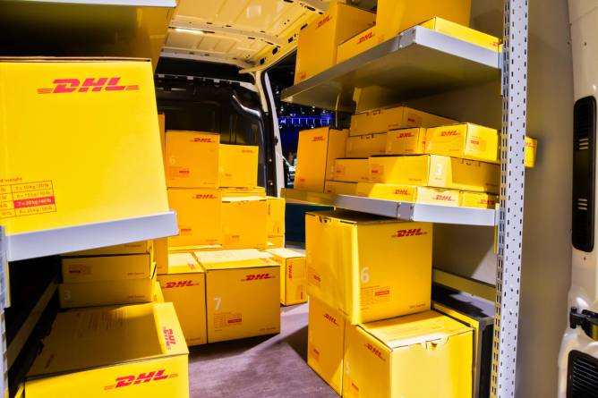DHL packages in a delivery van