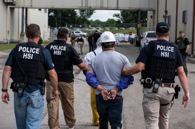 US Immigration and Customs Enforcement's (ICE) Homeland Security Investigations (HSI) special agents arrest alleged immigration violators at Fresh Mark, Salem, on June 19, 2018.