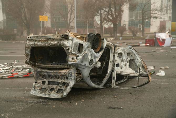 A burned-out automobile in Almaty, Kazakhstan