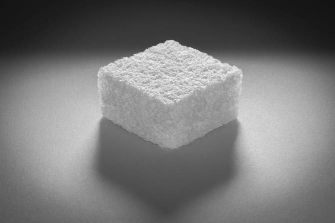 A square-shaped piece of Cruz Foam, which resembles Styrofoam.