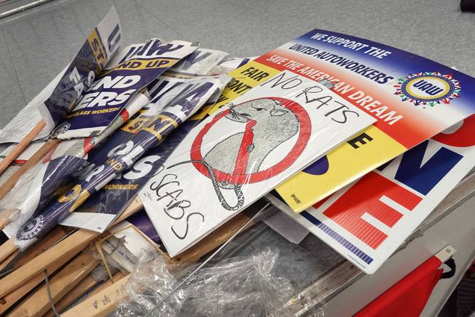 UAW strike signs in a pile