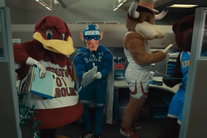 Cocky, the mascot for the University of South Carolina, and Duke's The Blue Devil appear in a cubicle in an image from ESPN's March Madness 2025 campaign