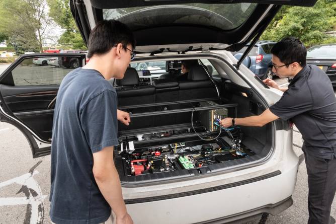 The drive-by-wire system pictured in the AV's trunk.