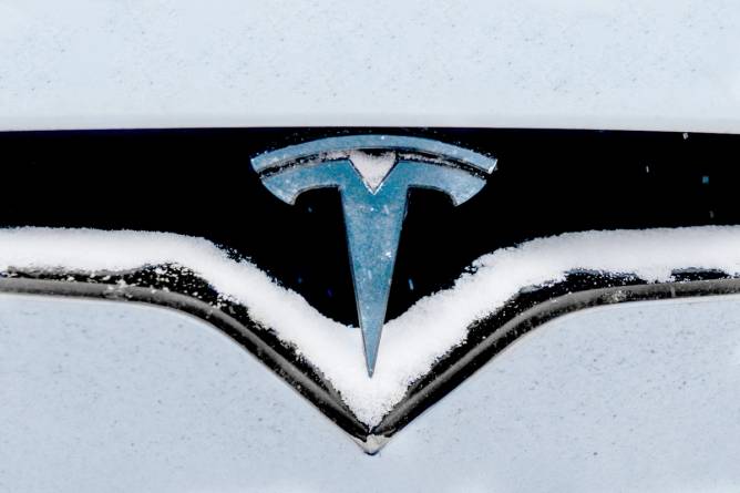 Tesla covered in snow