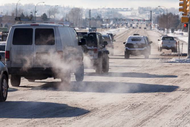 Vehicles driving down a roadway