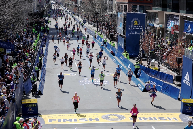 Runners make their way down Boylston street to the finish line during the 126th Boston Marathon on April 18, 2022 in Boston, Massachusetts.