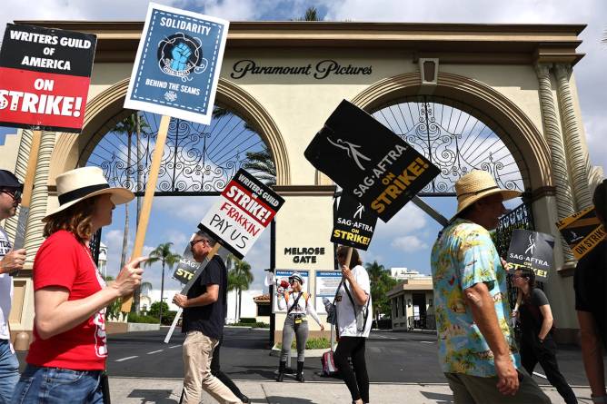 Striking WGA members picket outside Paramount Pictures