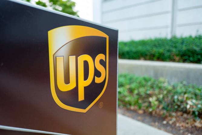 Close-up of the logo for United Parcel Service (UPS) on a package drop b...