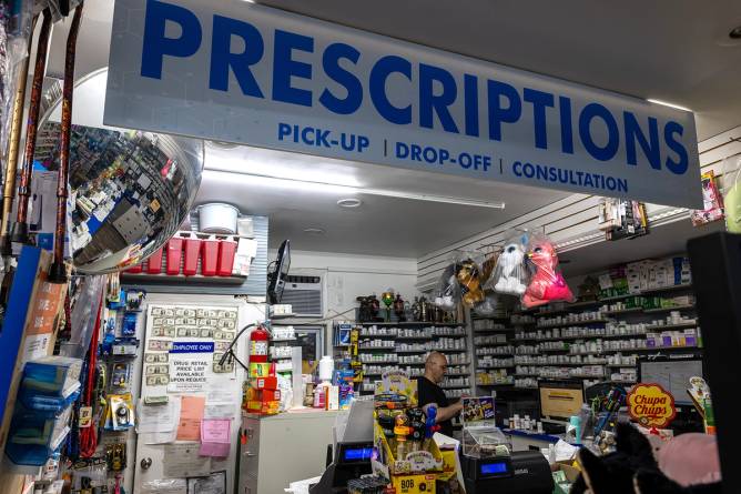 A pharmacist works at a NYC Discount Pharmacy in Manhattan.