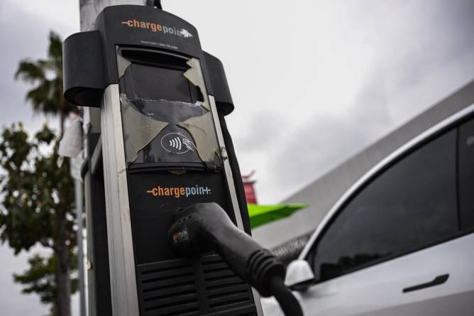 A ChargePoint charging station with a vehicle plugged in.