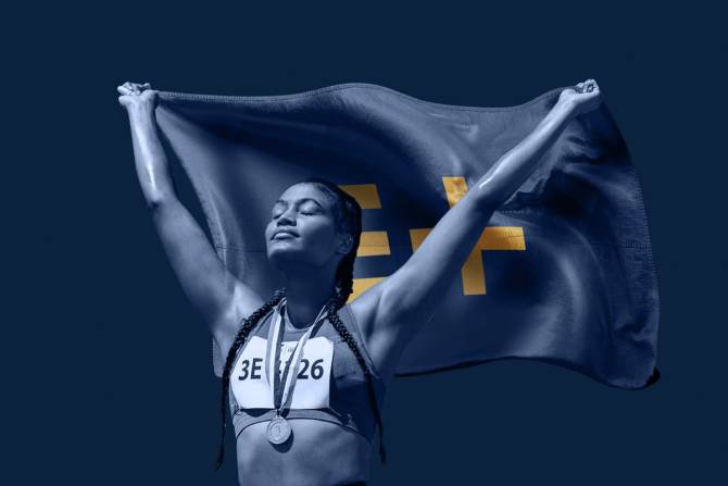 Athlete holding Enhanced Games flag