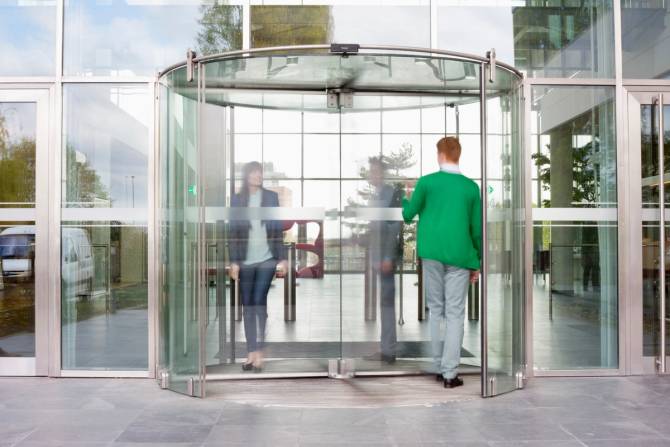 Employees enter and exit through revolving door