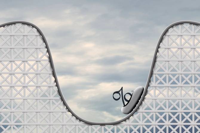 A percentage symbol riding a roller coaster.