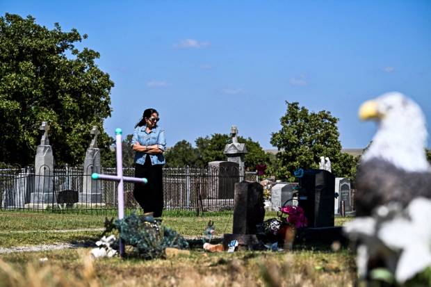 Mollie Burkhart's granddaughter visiting her grave