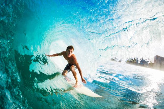 A surfer riding a wave. 