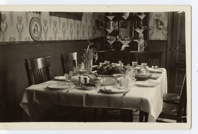 A vintage photo of a dining room.