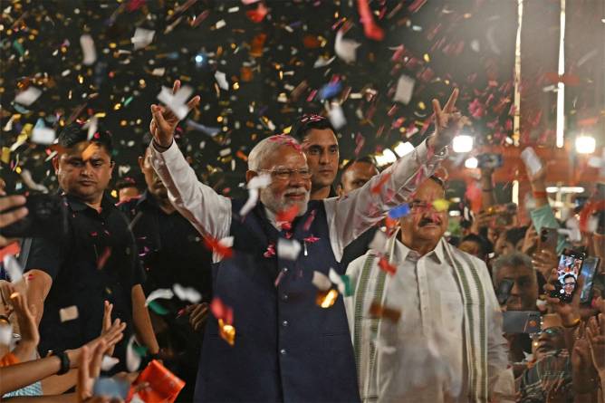 Indian Prime Minister Modi celebrating winning his third consecutive term with confetti