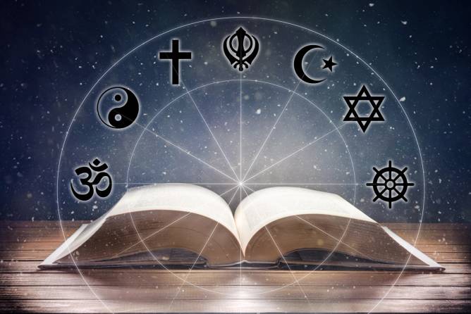 a book open flat on a table, with. various religious symbols floating above it