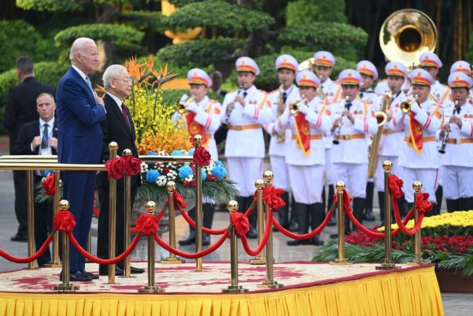 US President Joe Biden attends a welcoming ceremony hosted by Vietnam's Communist Party General Secretary Nguyen Phu Trong (2L) at the Presidential Palace of Vietnam in Hanoi on September 10, 2023. 