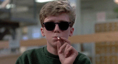A gif of Brian from the Breakfast Club smoking weed